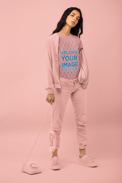 T-Shirt Mockup of a Woman Holding a Vintage Telephone at a Studio