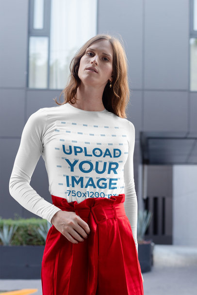 Mockup of a Confident Woman Wearing a Long Sleeve Tee in the City 