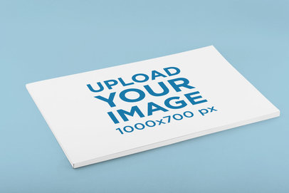 Mockup of a Horizontal Magazine Placed on a Customizable Surface