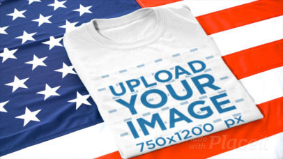 Video of a Person Placing a Folded T-Shirt Over an American Flag 