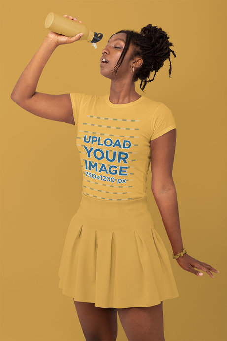 Monochromatic T-Shirt Mockup of a Stylish Woman Drinking Water at a Studio 