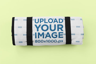 Mockup of a Rolled Picnic Blanket Against a Customizable Background