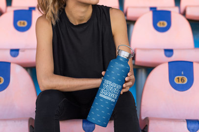 Mockup of a Woman Holding an Aluminum Bottle at a Stadium