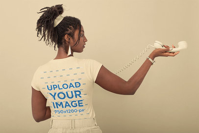 Back-View T-Shirt Mockup of a Woman in a Monochromatic Setting