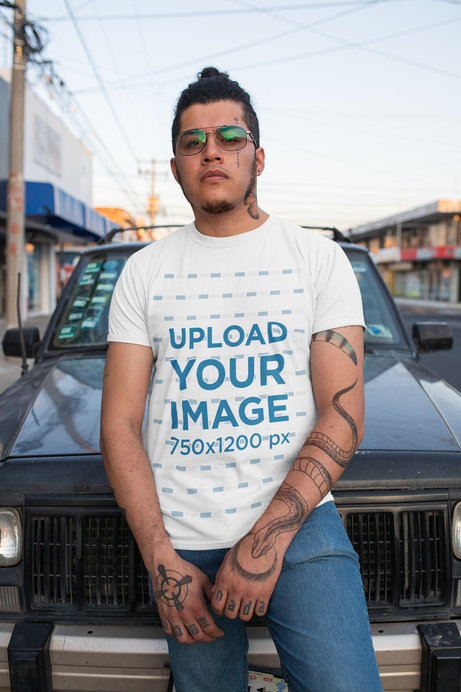 T-Shirt Mockup of a Tattooed Man Posing on the Street