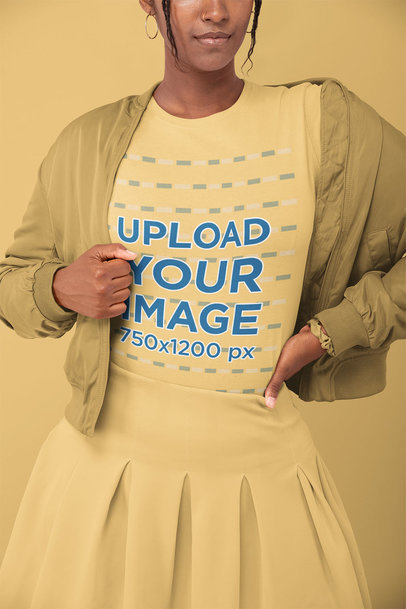T-Shirt Mockup of a Woman in a Monochromatic Outfit Posing at a Studio