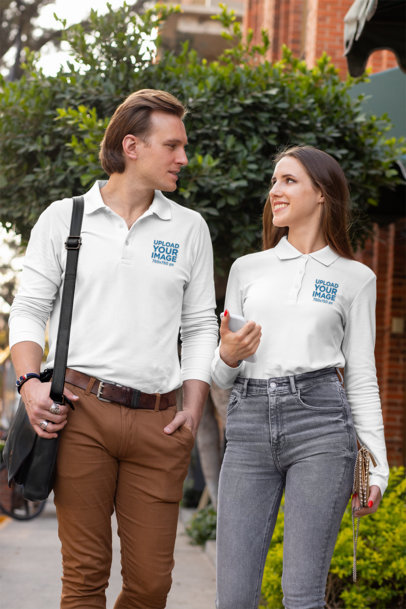 Mockup of a Couple Wearing Long Sleeve Polo Shirts on a Street