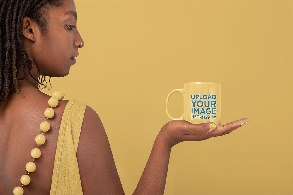 Mockup of a Woman Carefully Holding a Coffee Mug