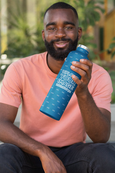 Mockup of a Bearded Man Holding an Aluminum Bottle 