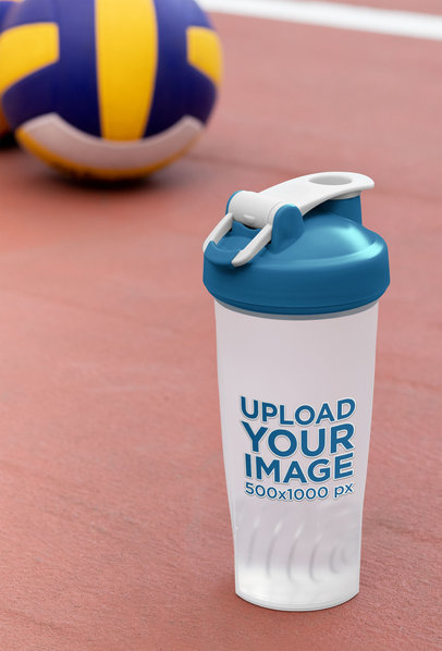 Mockup of a Blender Bottle Next to Some Volleyballs 