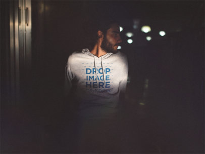 Hoodie Mockup of a Guy with Long Hair at Night