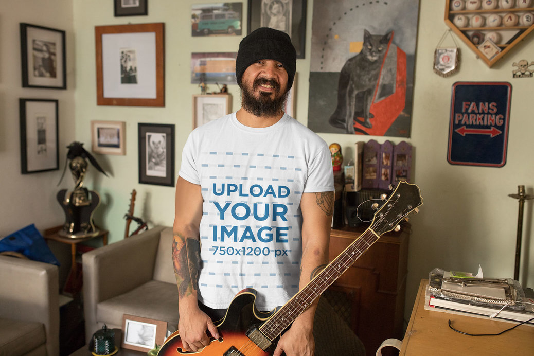 T-Shirt Mockup of a Man with His Electric Guitar at Home