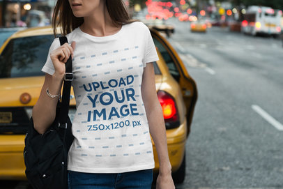 T-Shirt Mockup of a Woman in a Busy Street