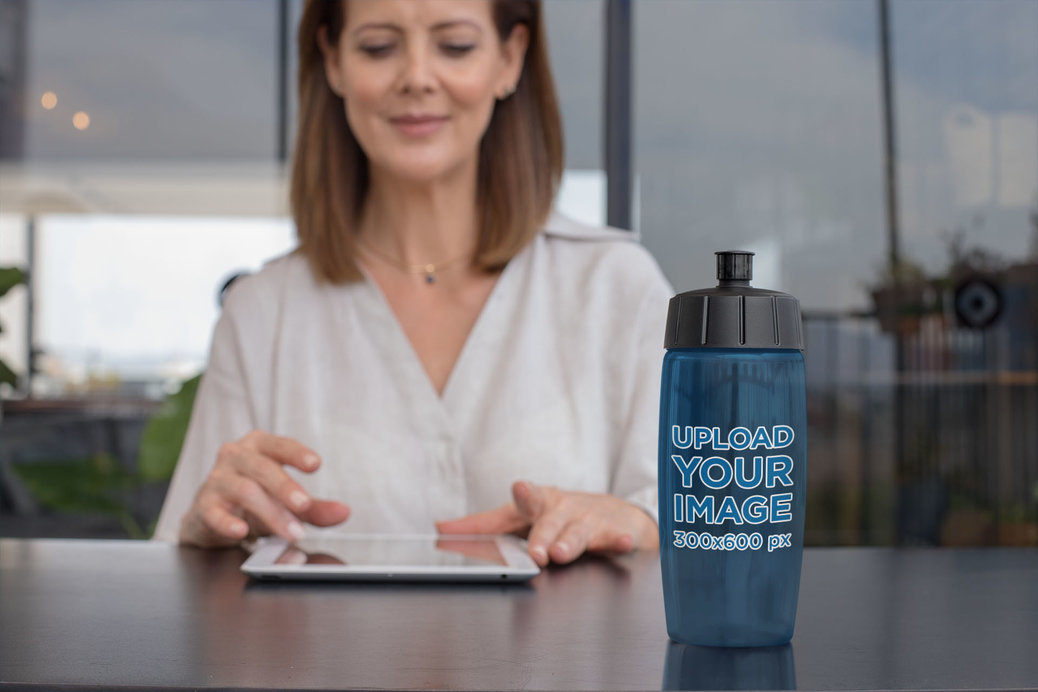 Bike Bottle Mockup of a Woman Working 