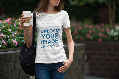 T-Shirt Mockup of a Woman with a Coffee To-Go in Her Hand 1957-el1