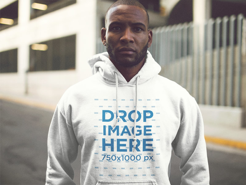 Serious Young Man Wearing a Pullover Hoodie Out in the Street