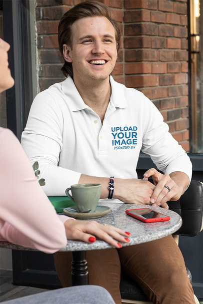 Long Sleeve Polo Shirt Mockup of a Man Enjoying a Coffee with a Woman