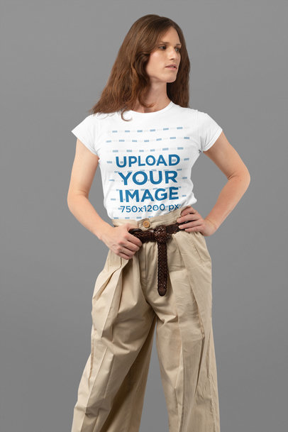 Mockup Featuring a Long-Haired Woman Wearing a Customizable T-Shirt at a Studio