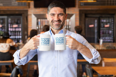 Mockup of a Man Holding Two Beer Mugs at a Bar