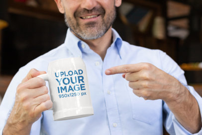 Mockup of a Man Pointing at His Beer Mug