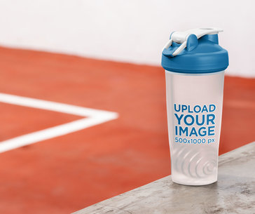 Blender Bottle Mockup Placed Against an Indoor Sports Court