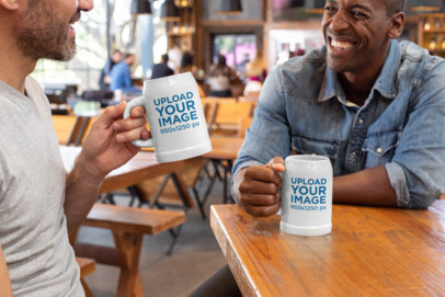 Mockup of Two Friends Holding 20 oz Beer Steins