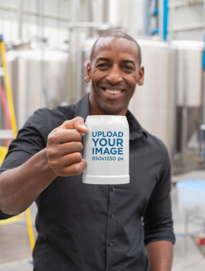 20 oz Beer Stein Mockup Featuring a Man at a Factory