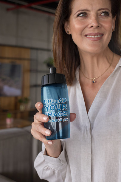 Mockup of a Smiling Elegant Woman with a Bike Bottle in Her Hand