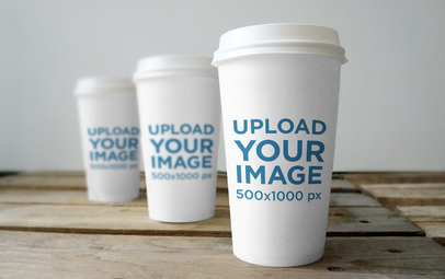 Mockup Featuring Three Coffee Cups Placed on a Rustic Wooden Table 3794-el1