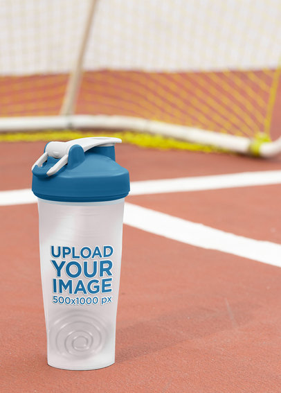 Mockup of a Shaker Bottle Placed by a Soccer Goal