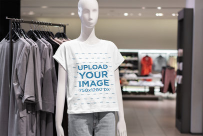 Mockup Featuring a Mannequin Wearing a Customizable T-Shirt at a Store