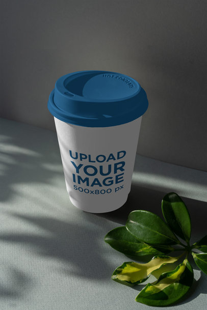 Mockup of a Paper Cup Featuring Some Leaves Shadows 3765-el1