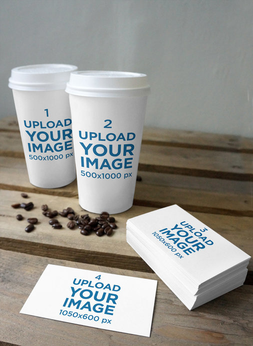 Mockup Featuring Two Coffee Cups and Some Business Cards on a Rustic Wooden Table