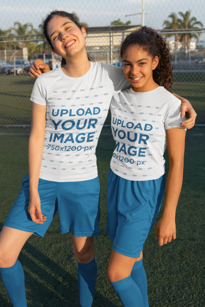 Mockup Featuring Two Friends Wearing Jerseys at a Soccer Field 