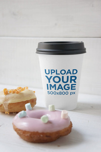 Coffee Cup Mockup Featuring Two Decorated Doughnuts 3783-el1