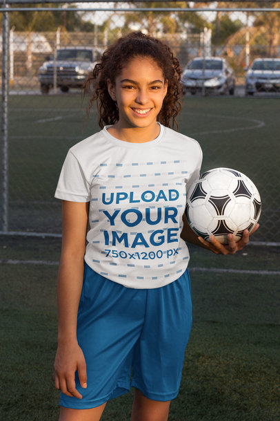 Jersey Mockup Featuring a Teen Holding a Soccer Ball