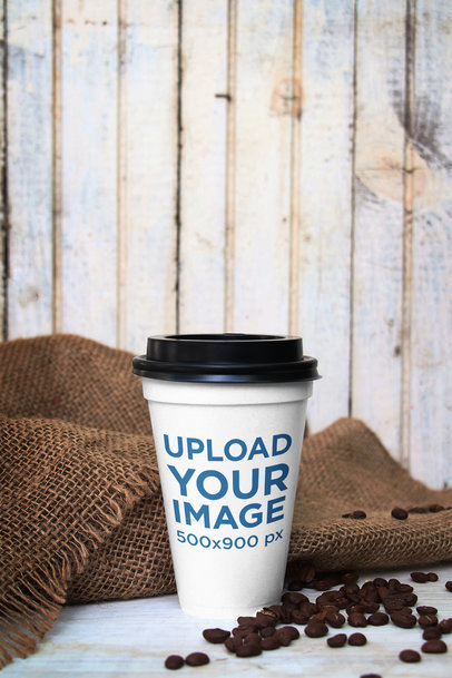 Mockup of a Paper Cup Placed by a Gunny Sack and Some Coffee Beans 3756-el1