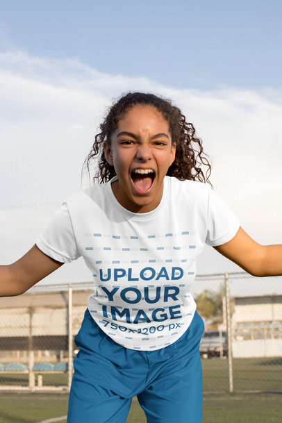 Jersey Mockup of a Teenage Girl Celebrating at a Soccer Field
