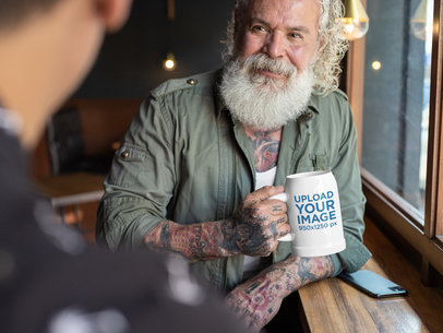 Mockup of a Joyful Senior Man Holding a 20 oz Beer Stein 33458