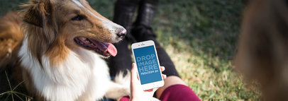 White iPhone Mockup of a Woman at a Park with her Dog