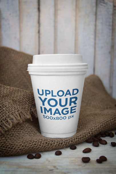 Mockup of a Paper Cup Featuring a Jute Sack and Coffee Beans 3758-el1