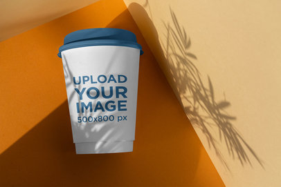 Elegant Mockup of a Coffee Cup Under a Shadow 3772-el1