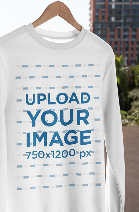 Mockup of a Crewneck Sweatshirt Hanging in a Balcony 