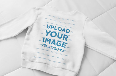 Flat Lay Sweatshirt Mockup Against a Blanket 33721