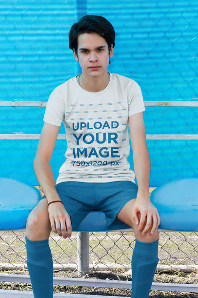 Jersey Mockup of a Teen Soccer Player on the Bench