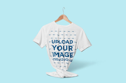 Mockup of a Customizable Tee on a Hanger Floating Against a Plain Color Backdrop 3713-el1