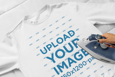 Mockup of a Woman Ironing a Sweatshirt 