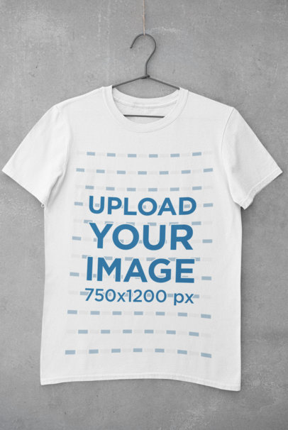 Mockup of a Basic Tee Hanging on a Concrete Wall 