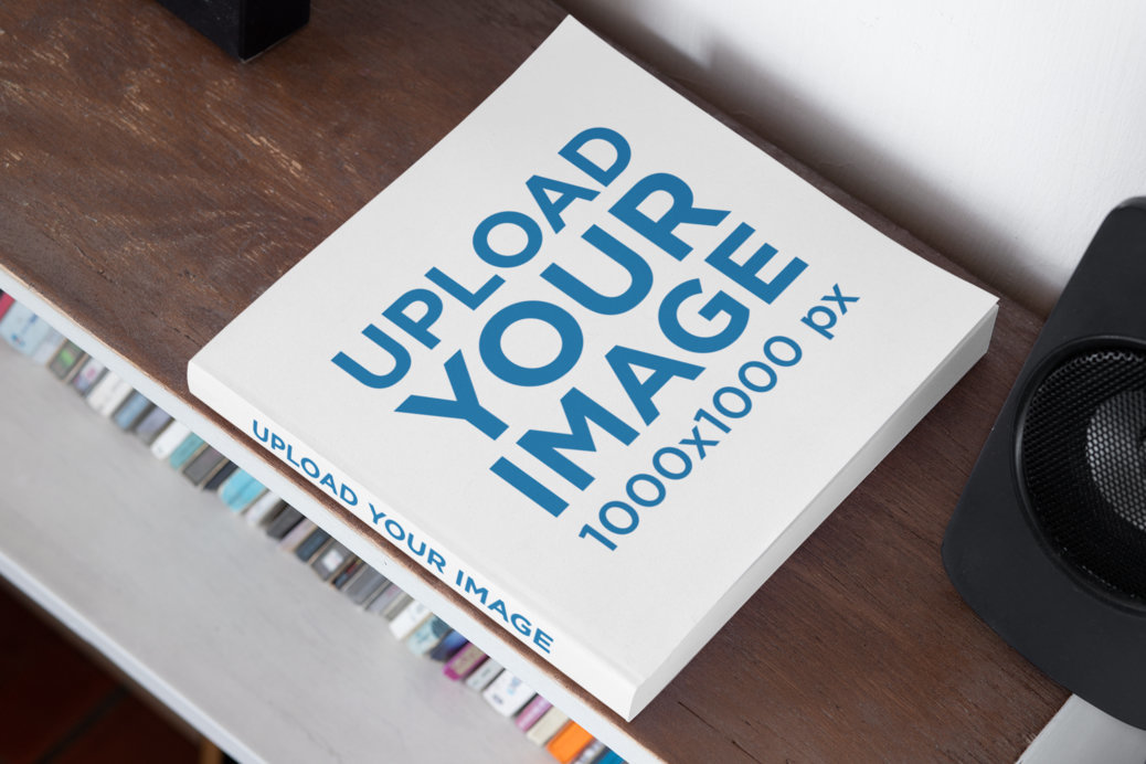 Mockup of a Square Book with a Customizable Spine