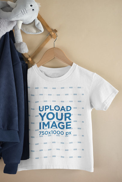 Mockup of a Kid's T-Shirt Hanged Next to a Stuffed Animal 33691